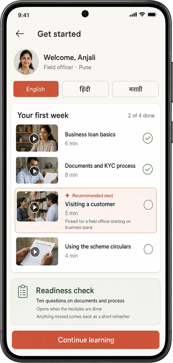 A new field officer's onboarding screen with a language selector, four short modules covering business loans, documentation and customer visits, two already completed, and the next one highlighted as picked for a field officer starting on business loans.